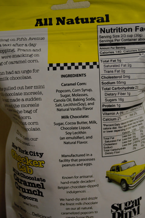 NYC Checker Cab Milk Chocolate Caramel Crunch Popcorn packaging with ingredients and nutritional information.