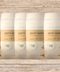 Five packs of Zesty Horseradish Vegetable Seasoning blend with horseradish, lime, and thyme on a rustic wooden background.