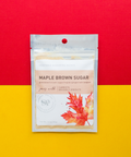 Maple Brown Sugar Vegetable Seasoning Pack with Fall Leaf Design on Red and Yellow Background